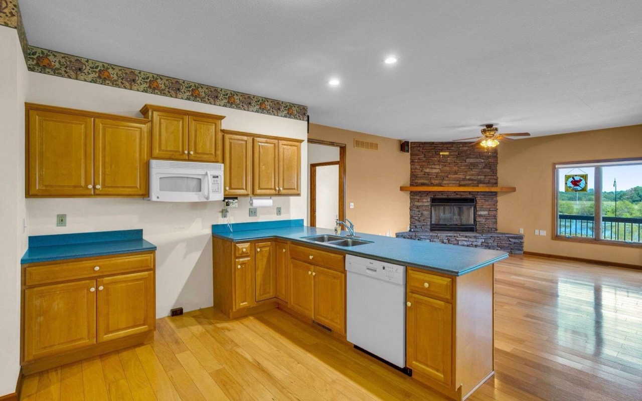 Kitchen before — orange oak cabinets and blue counters